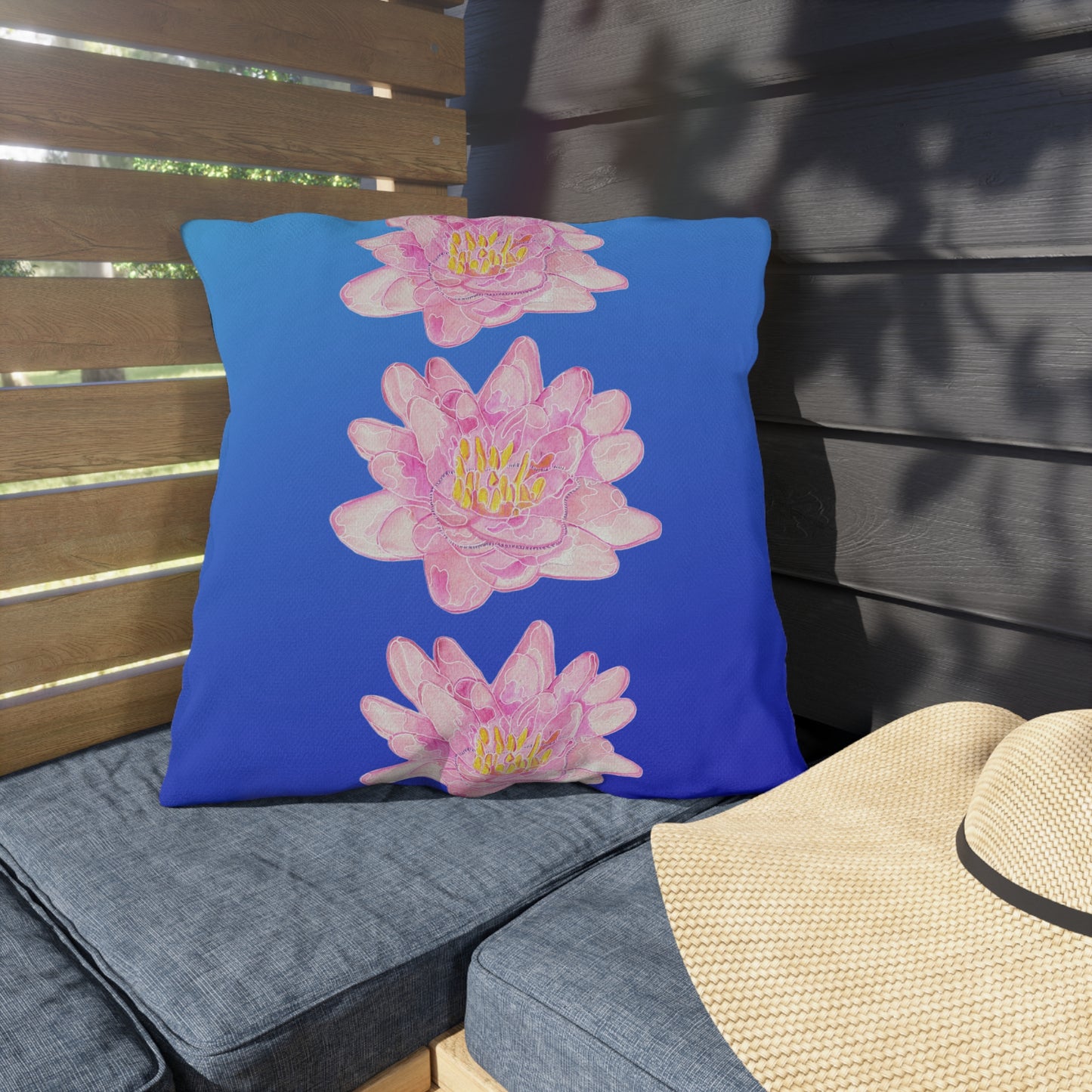 Outdoor Cushion with Pink Waterlilies on a Blue Background